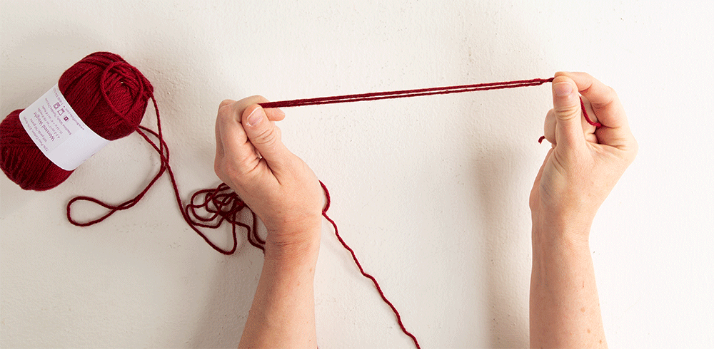 gif animation of triple-stranding step 3: slip knot becomes end of yarn