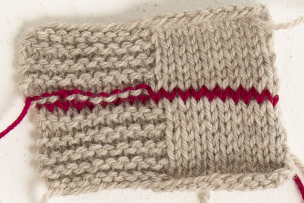 Swatch with grafted garter stitch and stockinette stitch sections, in contrasting color yarn