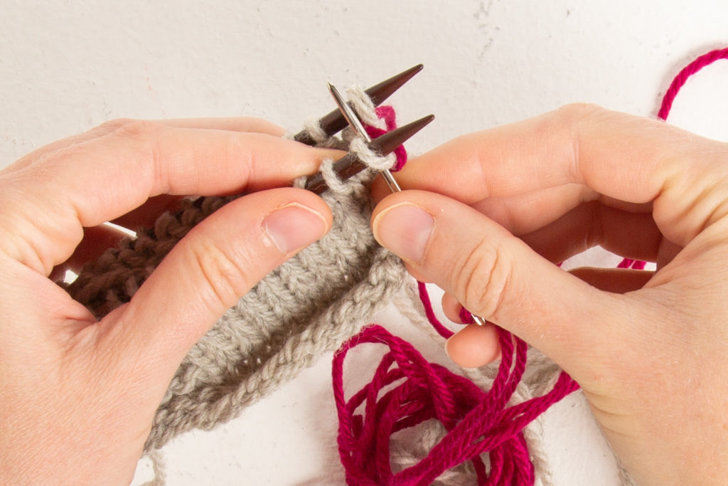 st st step 1: through front first stitch knit-wise