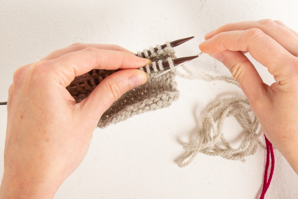 Setup step 1: through front first stitch purl-wise