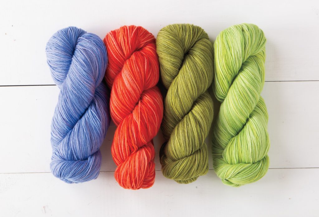 Four bright new colors of Stroll Tonal sock yarn.