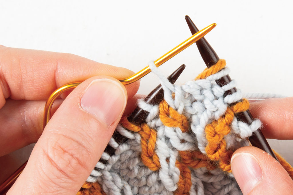 1-over-1 cable Left: hold up cable needle