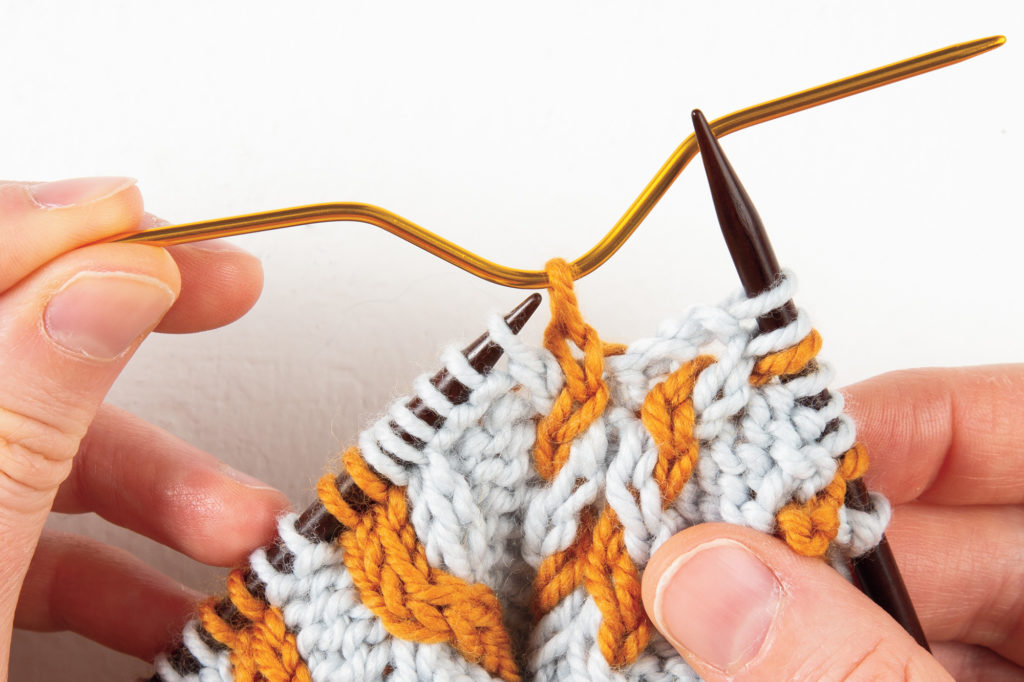 1-over-1 cable Right: first stitch on cable needle