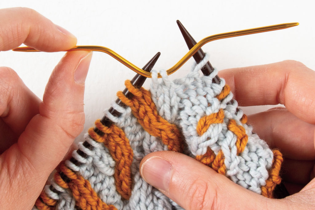 2-over-2 cable Left: first 2 stitches on cable needle