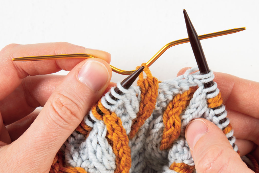 2-over-2 cable Right: first 2 stitches on cable needle, held in back