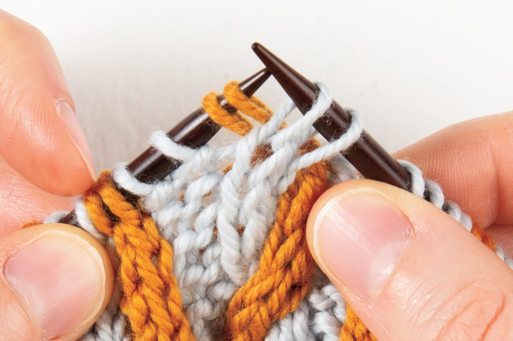 2-over-2 cable Right, without a cable needle: pull the right-hand needle stitches over to the right, in front