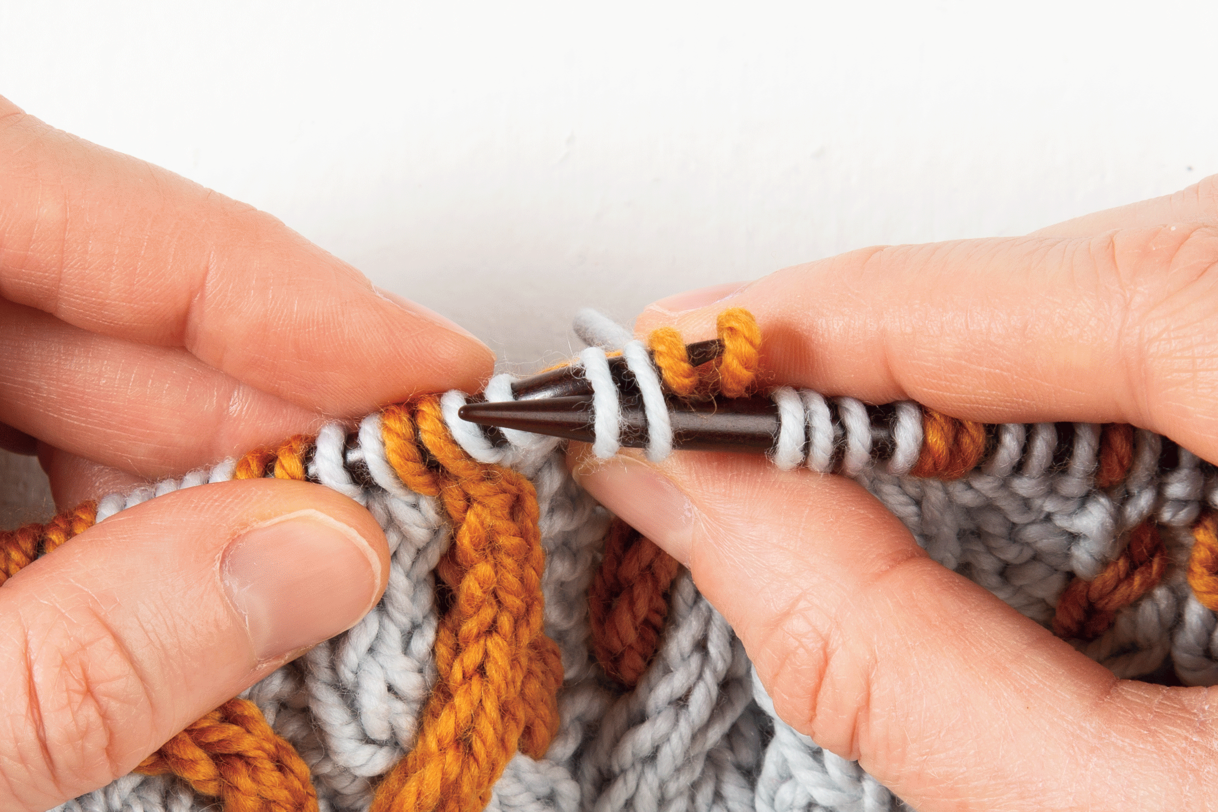 animation: 2-over-2 cable Right, without a cable needle: slip the first 2 stitches off the needle then back on to left-hand needle, behind the 2 stitches on the right-hand needle