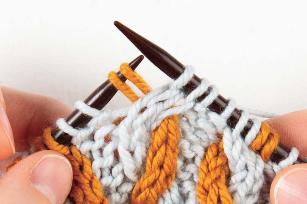 2-over-2 cable Right, without a cable needle: knit the first 2 stitches