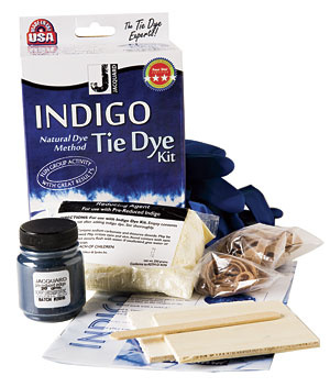 Indigo Tie Dye Kit and its contents: indigo dye, a reducing agent, 1 pair of gloves, wood pieces, 2 sizes of rubber bands, and an instruction booklet.