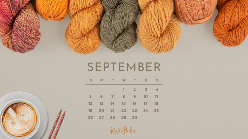 A taupe background with various orange yarns sticking out at the top of the frame. In the bottom left, a cup of coffee and some knitting needles. A ...
</p data-eio=