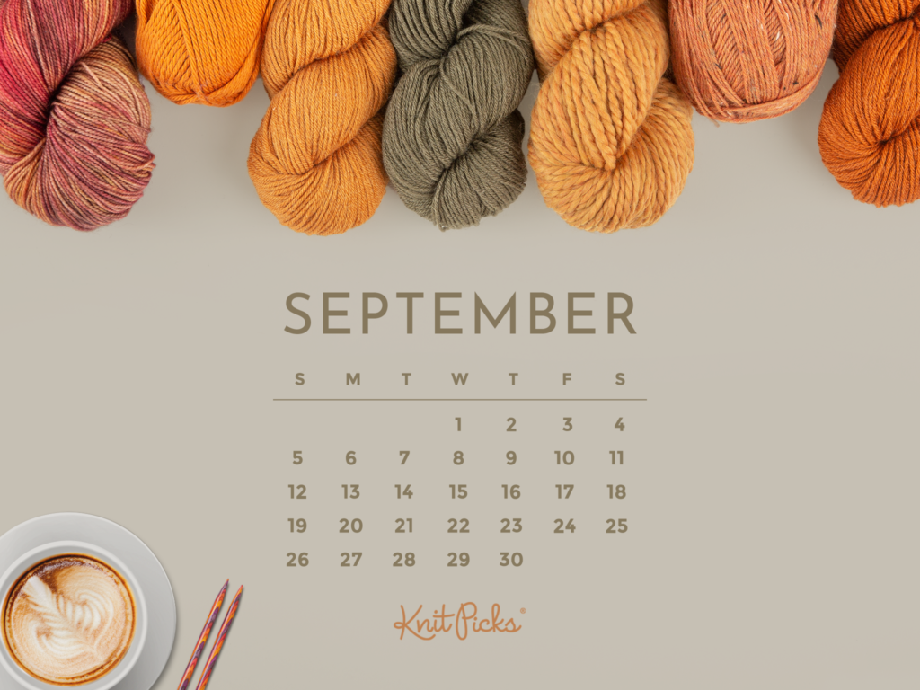 A taupe background with various orange yarns sticking out at the top of the frame. In the bottom left, a cup of coffee and some knitting needles. A September 2021 calendar.